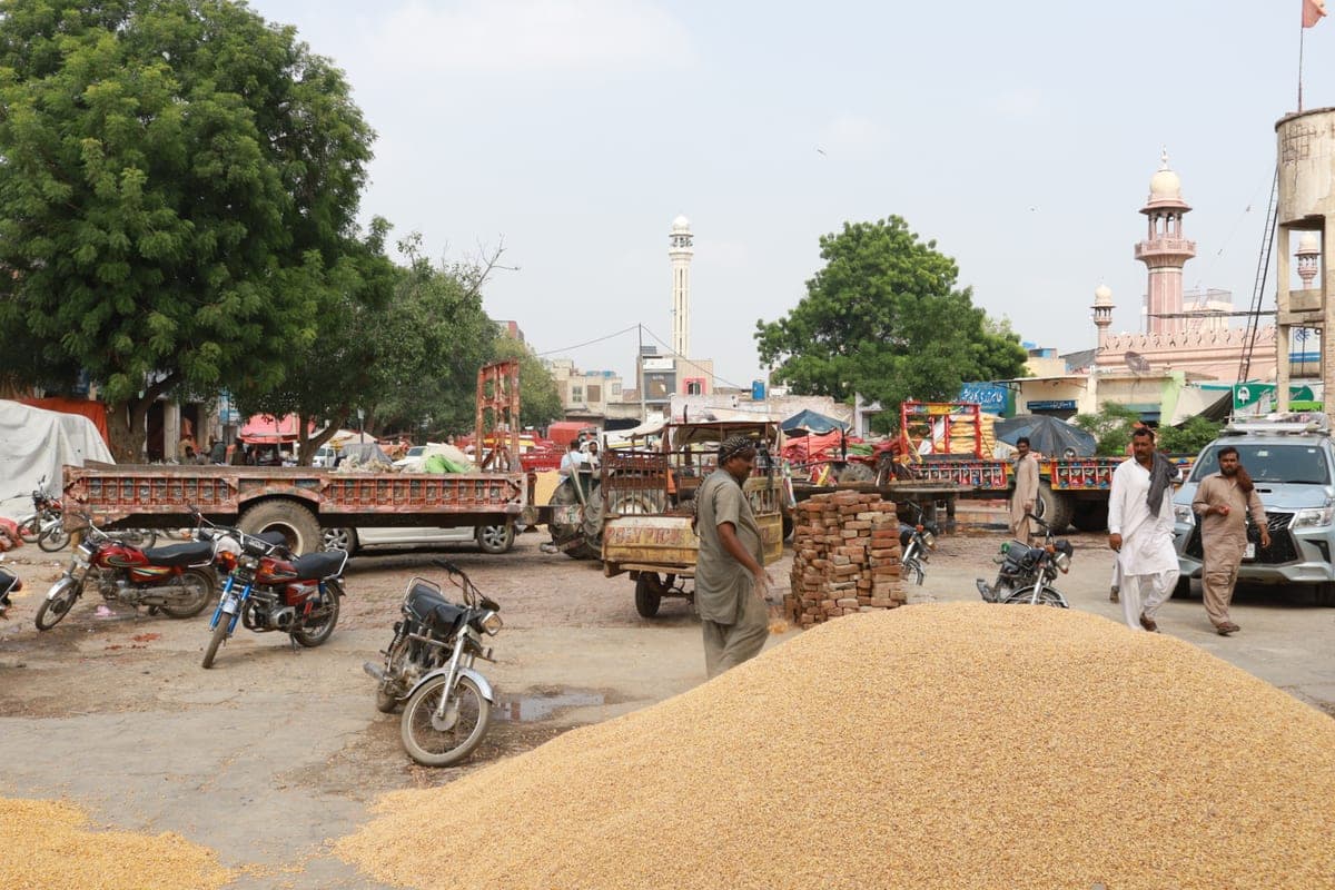 A busy market street near a local mosque